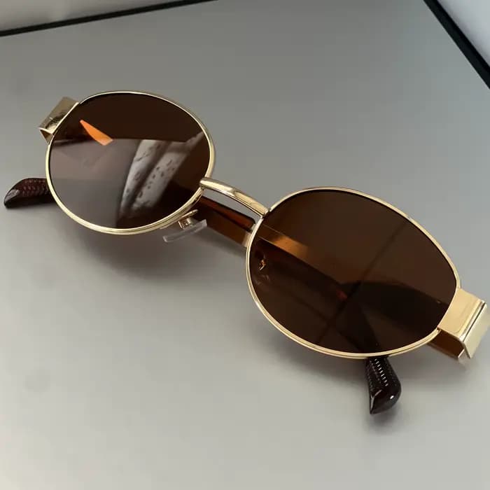 Lunettes de soleil métalliques haut de gamme de forme ovale sur le côté, un article de usage quotidi