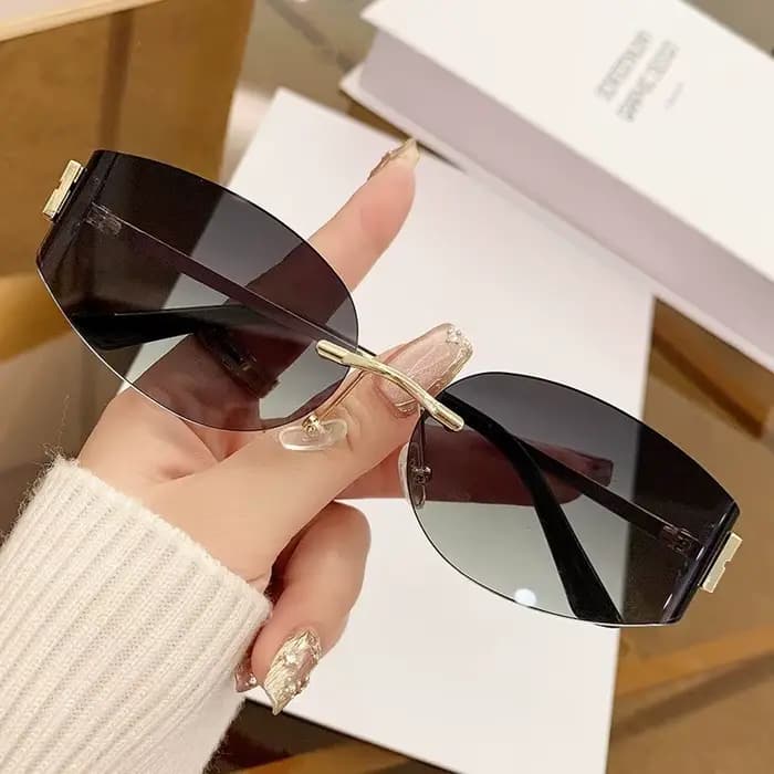 Lunettes de soleil ovales sans monture pour femmes