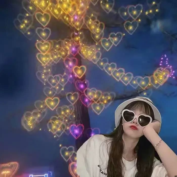 Lunettes de soleil en forme de cœur d'amour avec effets de changement de lumière