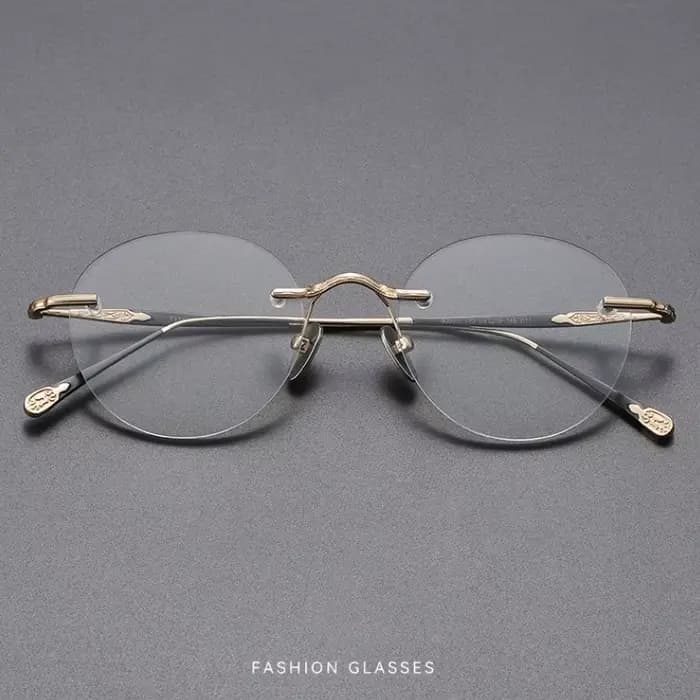 YIMARUILI Lunettes Rétro Rondes en Titane Sans Monture pour Hommes et Femmes
