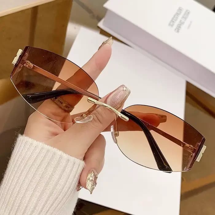 Lunettes de soleil ovales sans monture pour femmes